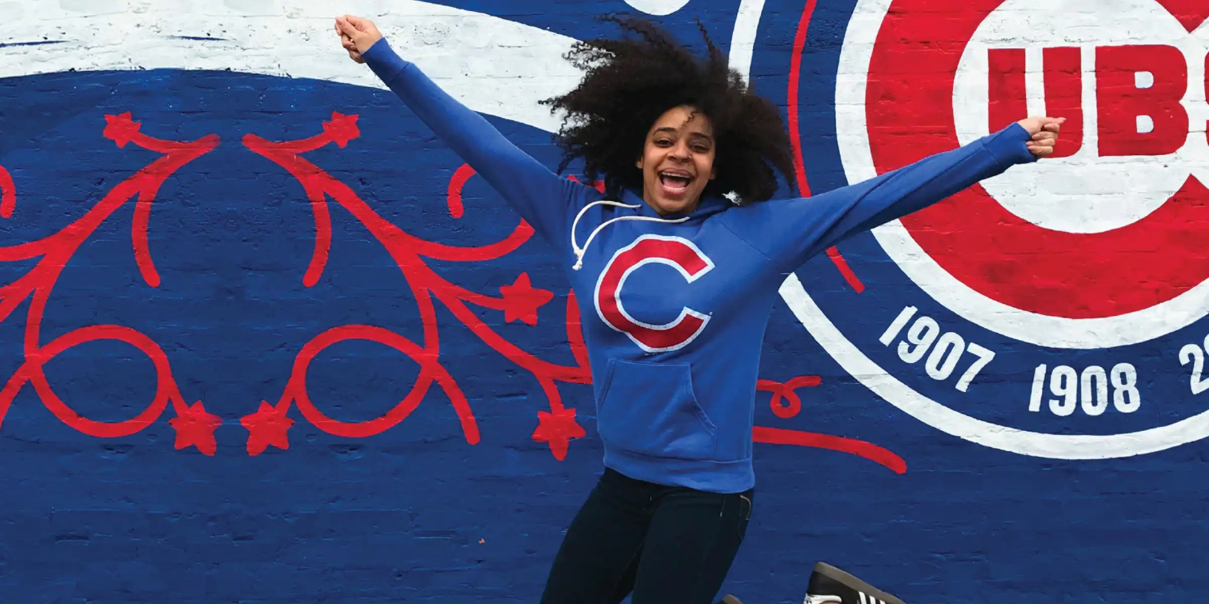 Chicago Cubs fan jumping for joy - desktop version