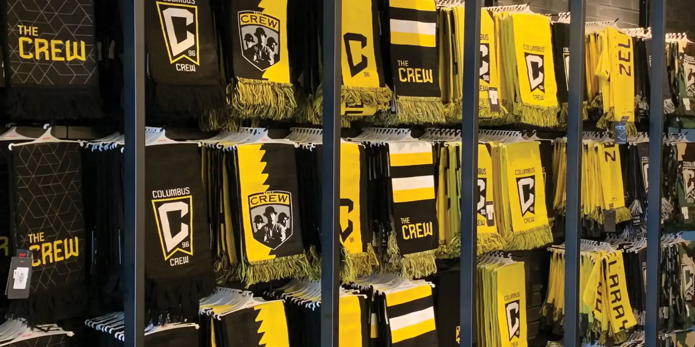 Columbus Crew gear shown in a retail setting - desktop version