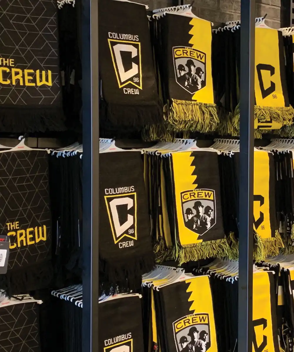 Columbus Crew gear shown in a retail setting - mobile version
