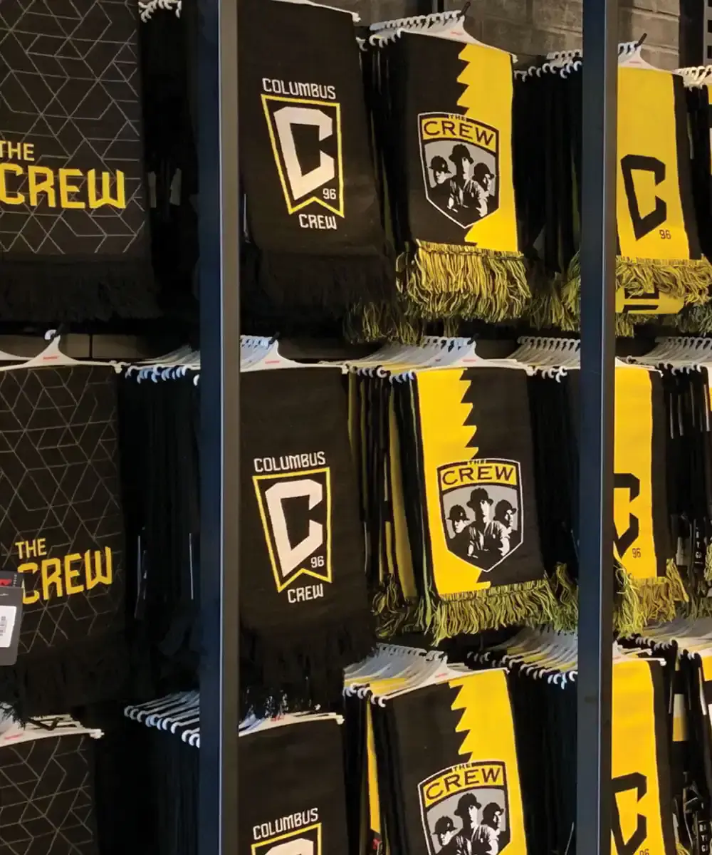 Columbus Crew gear shown in a retail setting - mobile version